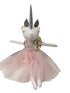 Unicorn plush toy with a pink dress on a white background