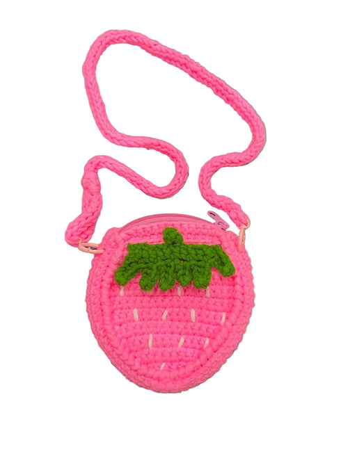 Pink crochet strawberry-shaped bag with a green leaf on a white background