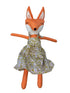 Stuffed fox toy wearing a floral dress on a white background