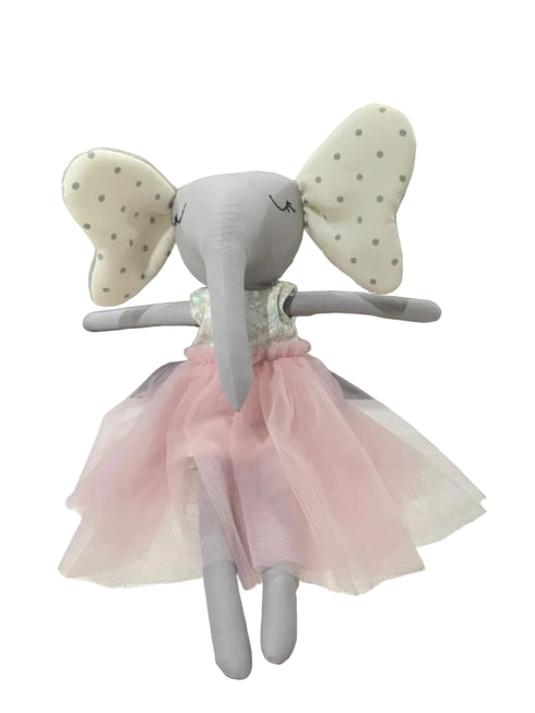 Stuffed elephant toy with a pink skirt on a white surface