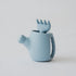 A silicone Blue watering can and fork set