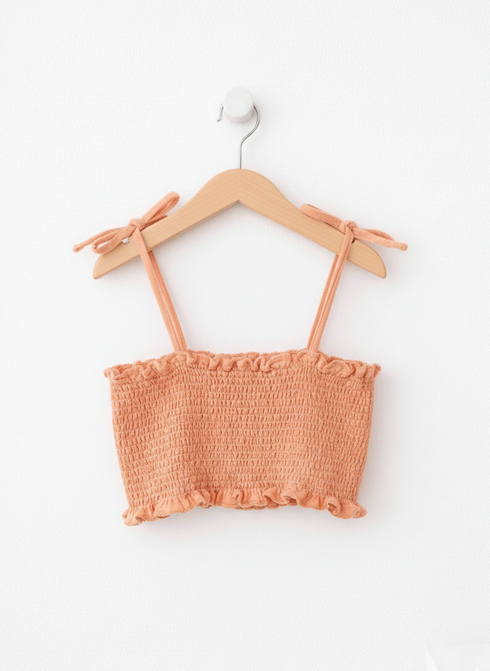 mango crop top with white bedground