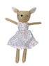 Toy deer doll with a white dress featuring pink polka dots on a white background