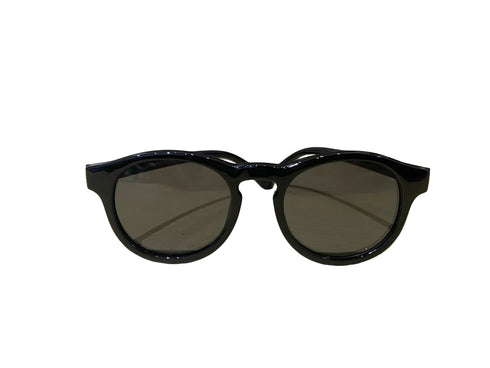 Black sunglasses with dark lenses on a white background
