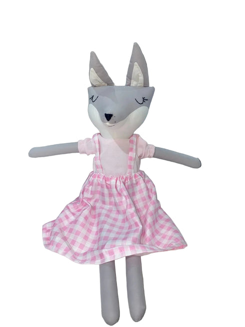 Stuffed toy fox in a pink checkered dress on a white background