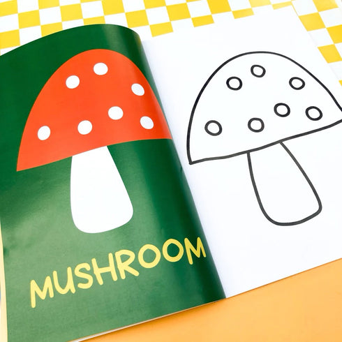 Colorful mushroom-shaped book with a black and white outline on a checkered background