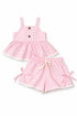 Pink gingham dress and shorts set on a white background