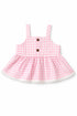 Pink gingham dress with buttons on a white background