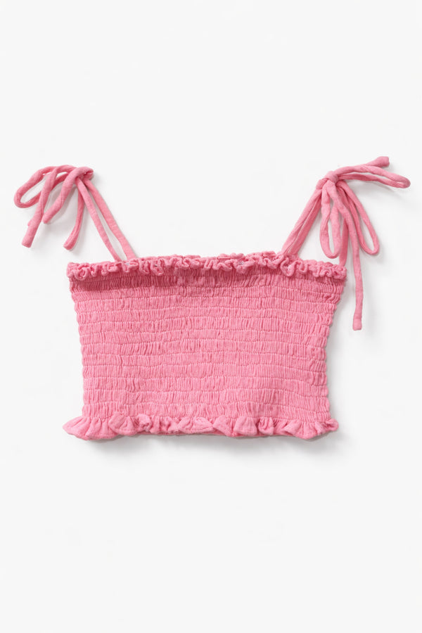 Pink ruched top with tie straps on a white background